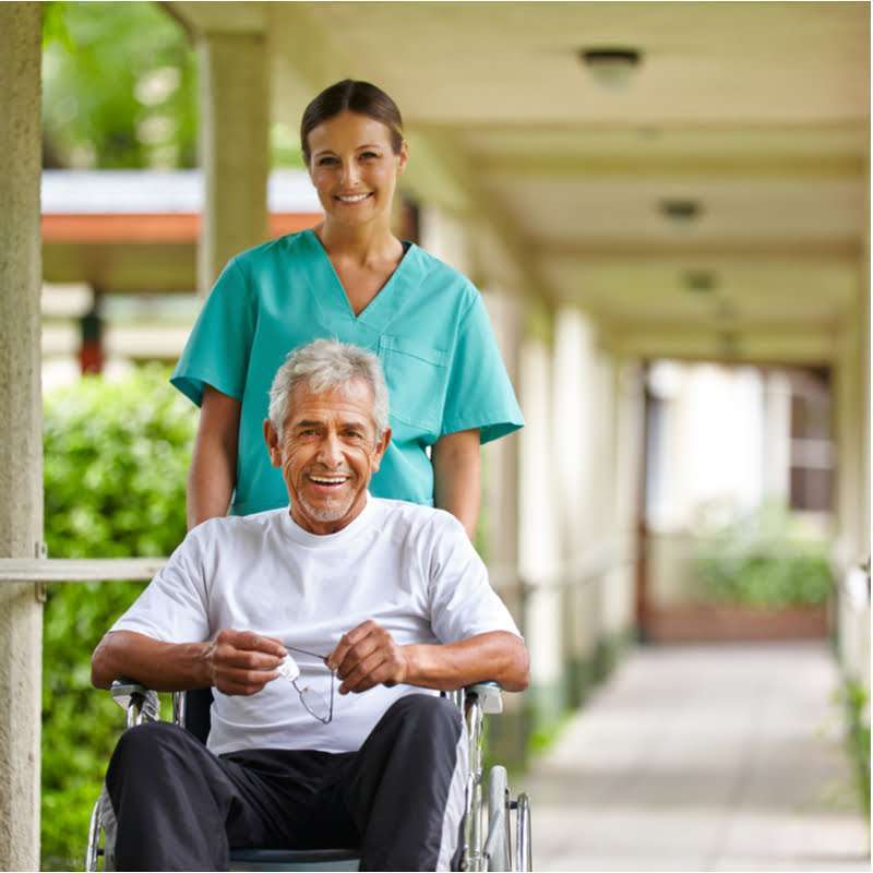 caretaker helping aged men