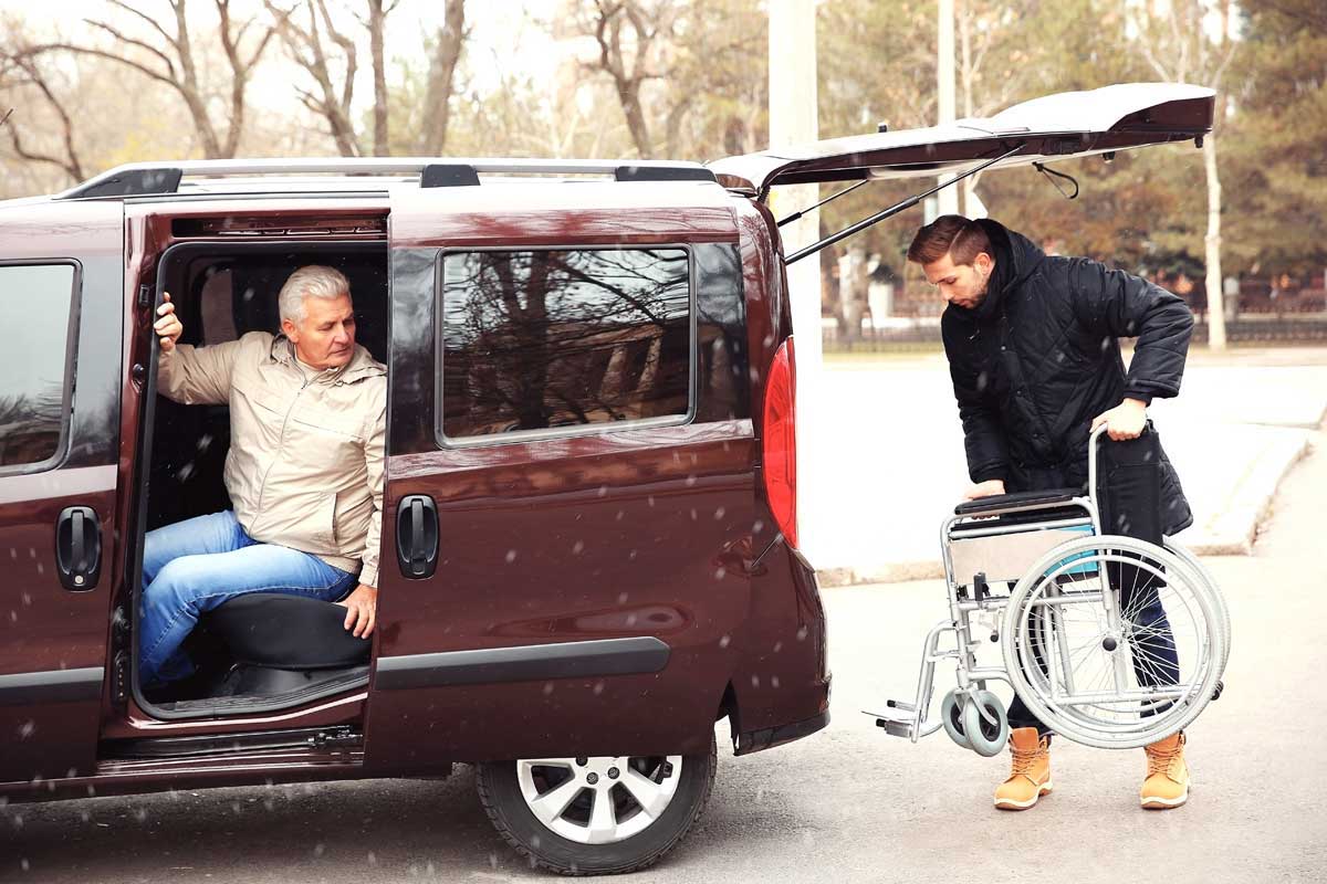 caretaker helping with wheelchair