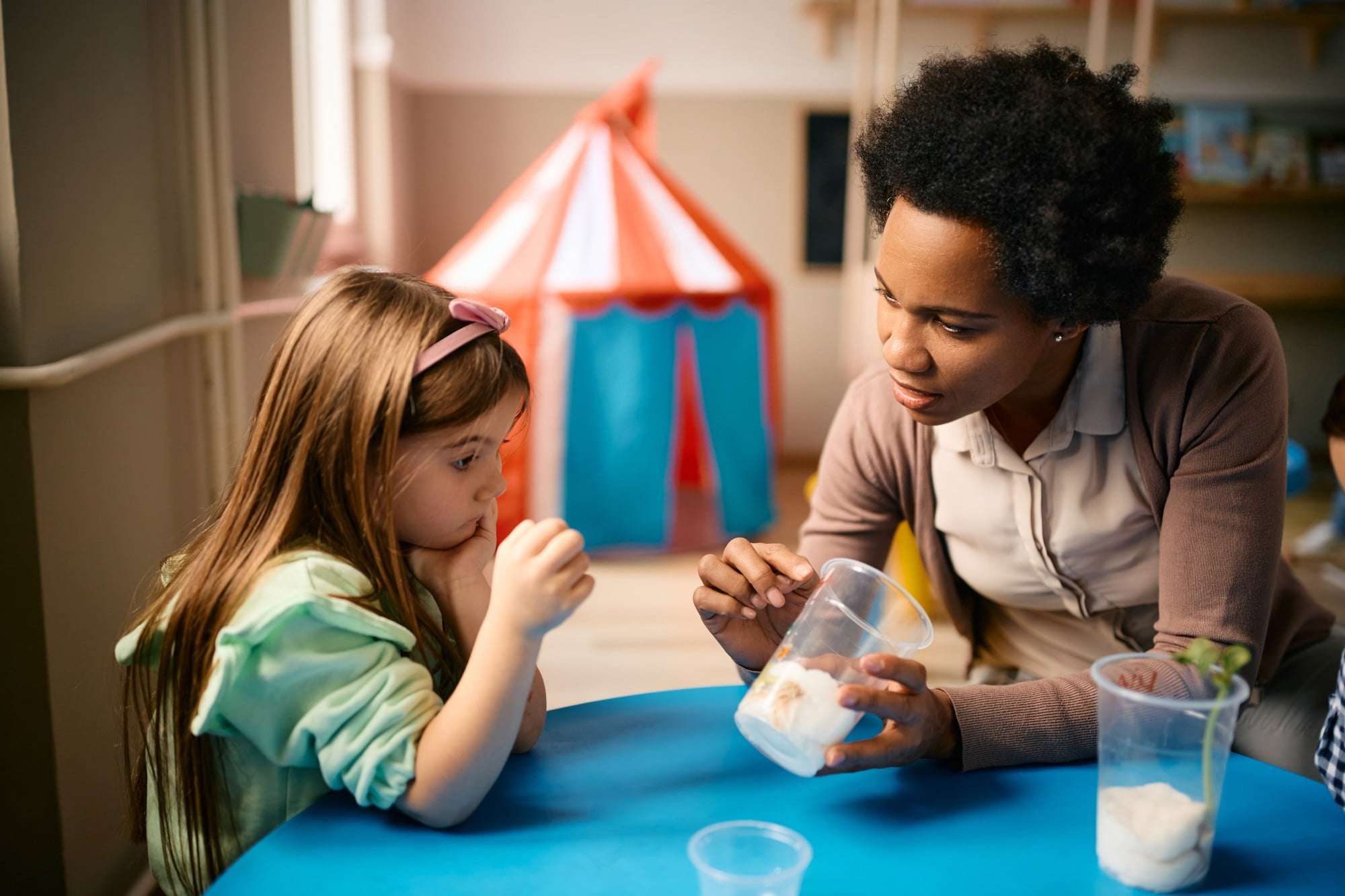 preschool teacher assisting